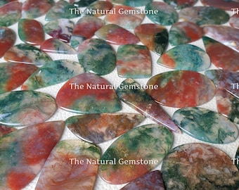 May include: A collection of green, red and white agate cabochons. The cabochons are smooth and polished, with a variety of patterns and textures. The Natural Gemstone is printed on the image.