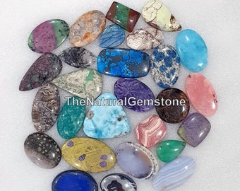 May include: Assortment of 20 colorful, natural gemstone cabochons in various shapes and sizes. TheNaturalGemstone is printed on the image.