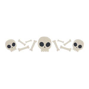 May include: A row of three cartoon skulls with black eyes and white bone crossbones.