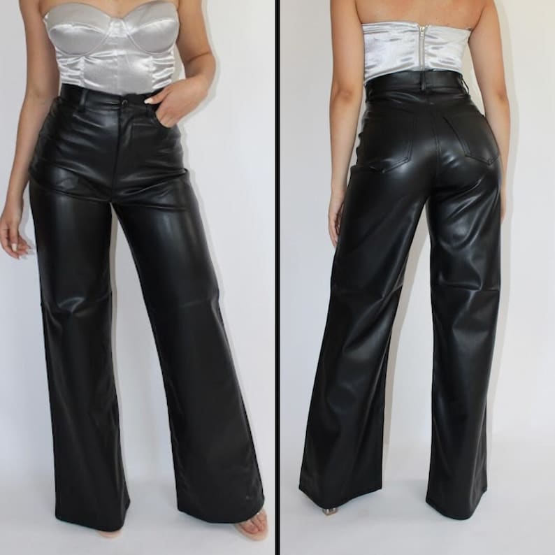 May include: Black leather wide-leg pants with a high waist and a zipper fly.
