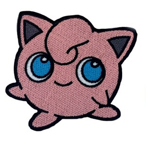 May include: Embroidered patch of a pink cartoon character with large blue eyes, a swirl on its forehead, and a smiling expression. The patch has a black border, suitable for clothing or accessories.