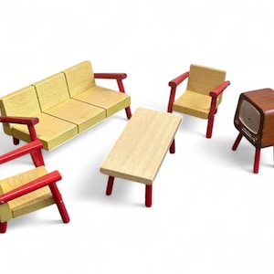 May include: A miniature wooden living room set with a yellow sofa, two chairs, a coffee table, and a vintage-style television. The furniture has red accents on the arms and legs, creating a retro aesthetic. The set is designed for play or display.