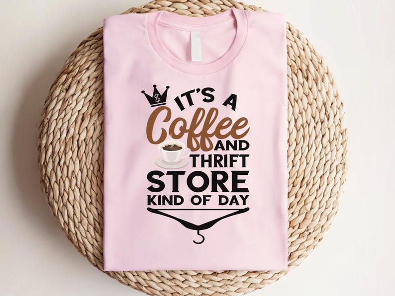 May include: Pink t-shirt with a black and brown graphic that says "It's a Coffee and Thrift Store Kind of Day".