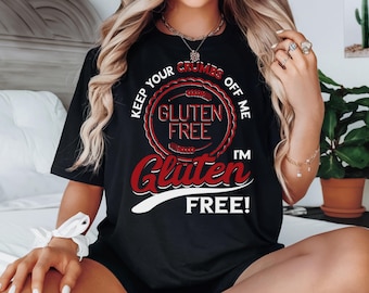 May include: A black t-shirt with white text that reads "Keep your crumbs off me I'm Gluten Free!" with a red circle around the words "Gluten Free".