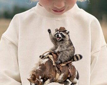 Funny Raccoon Meme Sweatshirt, Cowboy Raccoon Sweatshirt, Western Animal Graphic Kids Sweatshirt, Cute Horse Riding Raccoon Pullover