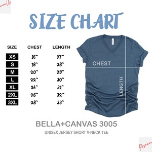 May include: A size chart for a unisex jersey short V-neck tee. The chart displays chest and length measurements in inches for sizes XS to 3XL. The tee is a blue-grey color.
