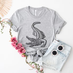 Fun and wild alligator tee for animal lovers! Great for camping, hiking, or gifting. Show off your love for gators in style and comfort.