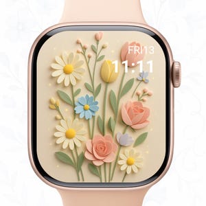 May include: A rose gold smartwatch with a floral watch face. The watch face displays a variety of pastel-colored flowers, including daisies, roses, and tulips, with the time 11:11 and the date Friday the 13th.