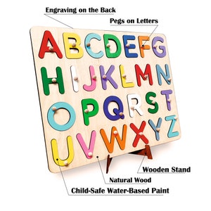 May include: Wooden alphabet puzzle with colorful letters and pegs. The puzzle is mounted on a wooden stand and has a child-safe water-based paint finish.