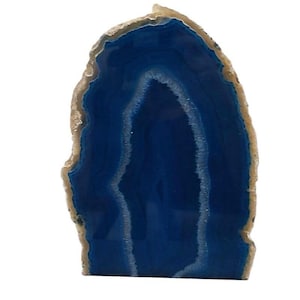 May include: A blue agate slice with a natural, irregular shape. The agate has a smooth, polished surface and features a distinctive pattern of white and blue bands.