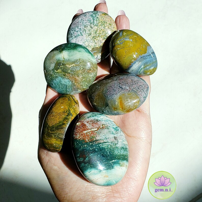 Ocean Jasper palm stones. Choose from the colorful palm stones in various shapes and sizes. These soothing and healing crystal palm stones will add a touch of color to all crystal collection. Ideal crystal gift.