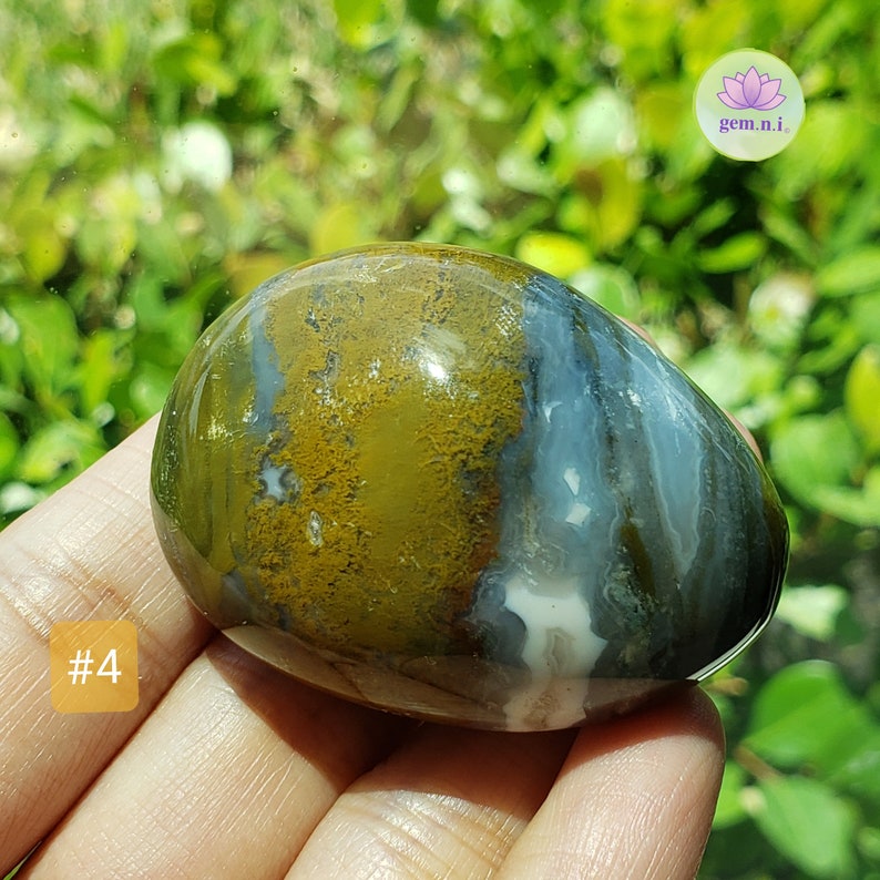 Ocean Jasper palm stones. Choose from the colorful palm stones in various shapes and sizes. These soothing and healing crystal palm stones will add a touch of color to all crystal collection. Ideal crystal gift.