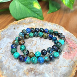 Azurite Malachite gemstone stretchy bracelet in 8mm round beads.These natural crystal bracelets are suitable for men and women. Fits up at 6.5inch wrists, this is known as the stone of heaven.Gift this stunning healing gift to all crystal collectors.