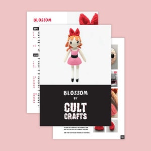 May include: Crochet pattern for a Blossom doll from the Powerpuff Girls. The pattern includes instructions for the arms, legs, and hair. The pattern is by Cult Crafts.