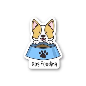 May include: A sticker featuring a cartoon corgi dog peeking over a light blue dog bowl filled with brown food. The bowl has a black paw print on it. The text "Dog Fooding" is below the bowl.