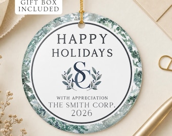 May include: A round ceramic ornament featuring a white centre with the text HAPPY HOLIDAYS, a dark blue monogram SC, and the text WITH APPRECIATION THE SMITH CORP. 2026. The border has a green and white marbled pattern, and it hangs from a gold string.