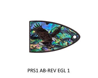 May include: A teardrop-shaped inlay piece featuring an iridescent abalone shell background with a dark brown eagle graphic in flight. The piece has a small circular hole on the right side and the text PRS1 AB-REV EGL 1 printed below it.