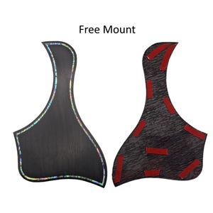 May include: Two guitar pickguards with the text Free Mount. The left pickguard is black with an iridescent abalone-style inlay border. The right pickguard shows the reverse side with a dark grey textured finish and multiple red adhesive strips.