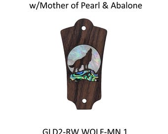 May include: A dark brown Bolivian Rosewood truss rod cover featuring an inlaid howling wolf silhouette against a circular mother of pearl moon and an abalone rock base. The piece has two mounting holes and text reading Bolivian Rosewood w/Mother of Pearl & Abalone and GLD2-RW WOLF-MN 1.