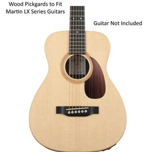 May include: A natural wood-colored acoustic guitar with a dark brown pickguard. The guitar has a round sound hole and a black bridge. Text on the image reads "Wood Pickguards to Fit Martin LX Series Guitars" and "Guitar Not Included."