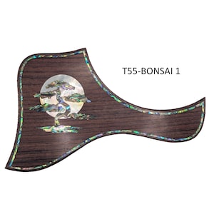 May include: A guitar pickguard with a dark wood grain finish. It features an inlaid design of a bonsai tree in front of a full moon. The pickguard is outlined with an iridescent border and has the text "T55-BONSAI 1".