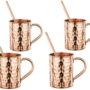 May include: Set of four copper Moscow mule mugs with hammered texture and matching copper straws.