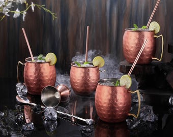 Set of 4 Handcrafted Stainless Steel Copper Plated Moscow Mule Mugs Hammered Finish 16 Oz. Gift with Jigger, Straws Brush and Spoon.