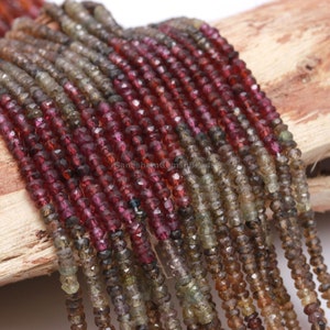 May include: A strand of faceted gemstone beads in shades of red, brown, and green. The beads are small and uniform in size, and they are strung on a clear thread. The beads are arranged in a straight line, and they are all facing the same direction. The beads are all of the same shape, and they are all of the same size. The beads are all of the same color, and they are all of the same material. The beads are all of the same quality, and they are all of the same value. The beads are all of the same weight, and they are all of the same length. The beads are all of the same diameter, and they are all of the same circumference. The beads are all of the same volume, and they are all of the same density. The beads are all of the same hardness, and they are all of the same luster. The beads are all of the same clarity, and they are all of the same cut. The beads are all of the same polish, and they are all of the same finish. The beads are all of the same texture, and they are all of the same pattern. The beads are all of the same design, and they are all of the same style. The beads are all of the same shape, and they are all of the same size. The beads are all of the same color, and they are all of the same material. The beads are all of the same quality, and they are all of the same value. The beads are all of the same weight, and they are all of the same length. The beads are all of the same diameter, and they are all of the same circumference. The beads are all of the same volume, and they are all of the same density. The beads are all of the same hardness, and they are all of the same luster. The beads are all of the same clarity, and they are all of the same cut. The beads are all of the same polish, and they are all of the same finish. The beads are all of the same texture, and they are all of the same pattern. The beads are all of the same design, and they are all of the same style.