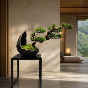 May include: A small bonsai tree with vibrant green foliage and a textured, gnarled trunk, planted in a dark, crescent-shaped stone vessel. The vessel features a rough, dark grey exterior and a mossy interior, resting on a black metal stand.