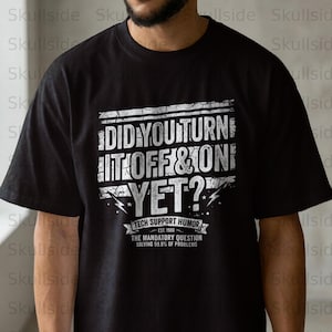 May include: Black t-shirt featuring a white graphic with the text "DID YOU TURN IT OFF & ON YET?" in a distressed style. The design includes "TECH SUPPORT HUMOR" and "THE MANDATORY QUESTION SOLVING 99.9% OF PROBLEMS".