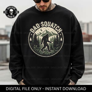 May include: Black sweatshirt featuring a circular graphic with the text "DAD-SQUATCH" and an illustration of Bigfoot walking through a forest, holding a mug. The design includes mountains and trees. The sweatshirt also has the text "DIGITAL FILE ONLY - INSTANT DOWNLOAD".