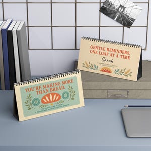 custom desk calendar for sourdough bakers, flipbook with gentle reminders and uplifting positive quotes sitting on a kitchen table as decor