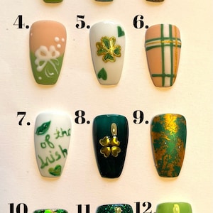 May include: A collection of twelve St. Patrick's Day-themed nail designs. The designs include shamrocks, rainbows, and glitter accents in green, gold, and other colors. The word "Designs" is at the top of the image.