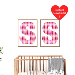 May include: Two framed prints, each showing the letter "S" made of red and pink hearts. The prints are in light wood frames. A red heart graphic with "Instant Download" is in the upper right corner.