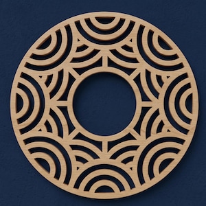 May include: A circular light brown wooden wall art piece featuring a laser-cut geometric pattern of concentric semi-circles arranged in a radial design around a central open circle. The wood grain is visible throughout the flat, cutout structure.