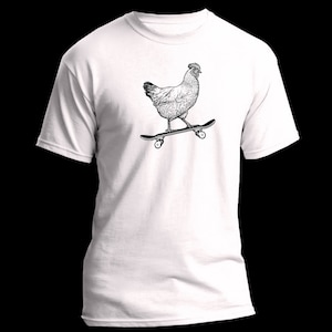 May include: A white t-shirt with a black and white illustration of a chicken skateboarding.