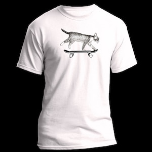 May include: White t-shirt with a black and white illustration of a cat skateboarding.