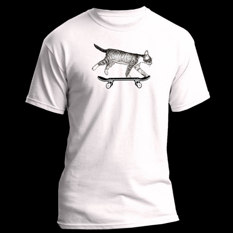 May include: White t-shirt with a black and white illustration of a cat skateboarding.