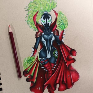 May include: A hand-drawn illustration of a female superhero with green flames for hair, wearing a black and white costume with a red cape. She has a skull on her hip and is holding green flames in her hands.
