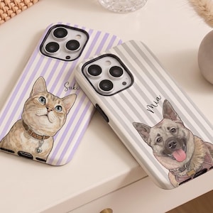 May include: Two smartphone cases featuring custom pet portraits. The left case has a light purple striped pattern with a cat illustration and the name Suki. The right case has a grey striped pattern with a dog illustration and the name Mia.