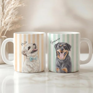 May include: Two white ceramic mugs featuring vertical stripes and dog illustrations. The left mug has a light orange striped pattern with a drawing of a dog named Milo wearing a blue bow tie. The right mug has light green stripes and a Rottweiler named Gunnar.