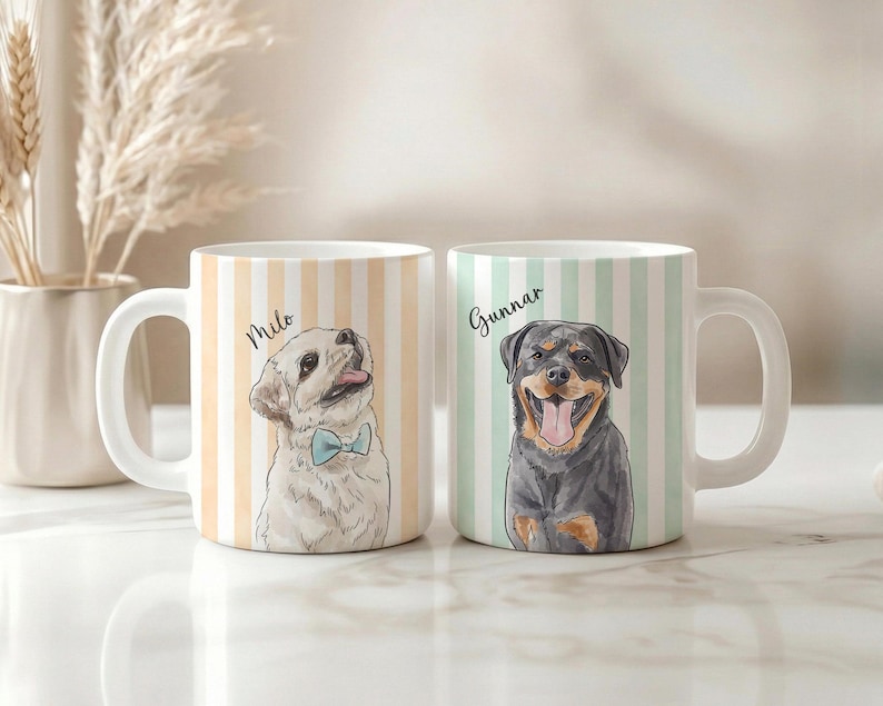 May include: Two white ceramic mugs featuring vertical stripes and dog illustrations. The left mug has a light orange striped pattern with a drawing of a dog named Milo wearing a blue bow tie. The right mug has light green stripes and a Rottweiler named Gunnar.