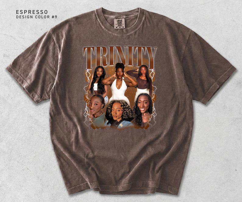 May include: Espresso-colored t-shirt with a graphic featuring the word "TRINITY" in a vintage font. The graphic includes images of six women. The shirt has a crew neck and short sleeves. The design color is #9.