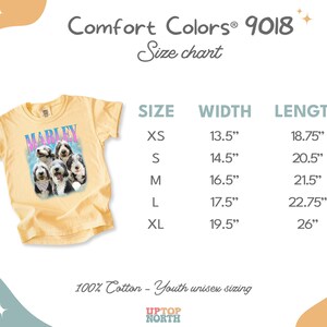 May include: A pale yellow t-shirt featuring a graphic of four dogs and the name MARLEY in blue and pink text. A size chart displays widths and lengths in inches for sizes XS through XL, ranging from 13.5 to 19.5 inches wide and 18.75 to 26 inches long.
