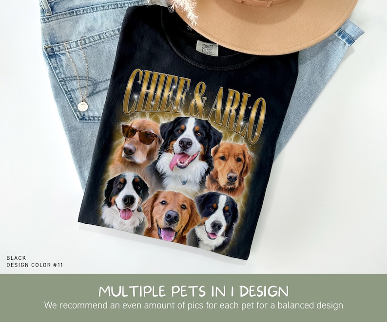 May include: A black t-shirt featuring a graphic print with the text CHIEF & ARLO in gold lettering above six dog portraits. The dogs include golden retrievers and Bernese mountain dogs, with one dog wearing sunglasses. The shirt is folded on blue jeans.
