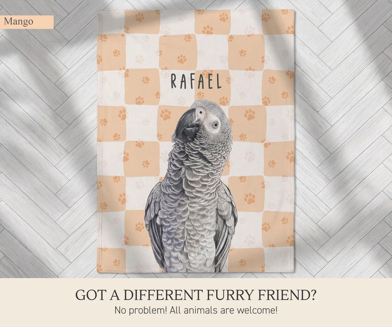 May include: A rectangular throw blanket featuring a light peach and white checkered pattern with small orange paw prints. The center displays a realistic illustration of a grey African Grey parrot and the name RAFAEL in black text.