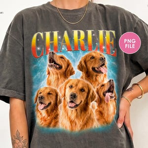 Puede incluir: Una camiseta gris carbón con un estampado gráfico de cinco perros golden retriever. Sobre los perros, el nombre CHARLIE está impreso en letras grandes y negritas con un degradado naranja y amarillo. El fondo del gráfico es una nebulosa azul estrellada.