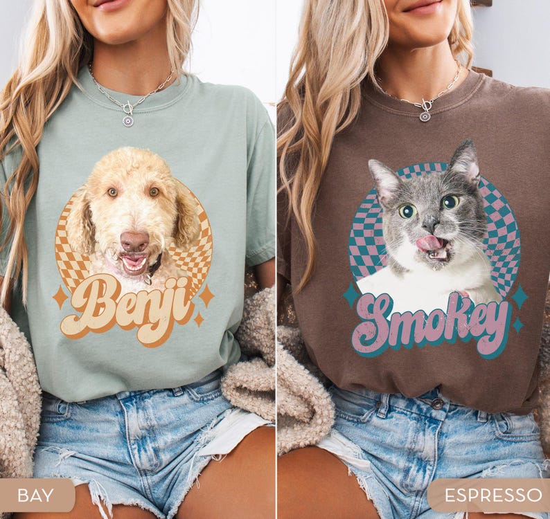 May include: Two t-shirts, one bay-colored and one espresso-colored, each featuring a pet portrait. The bay shirt has a dog portrait with the name "Benji" in retro lettering. The espresso shirt has a cat portrait with the name "Smokey".