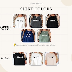May include: A color chart for t-shirts labeled UPTOPNORTH. The Comfort Colors section displays white, pepper, black, true navy, and moss shirts. The Gildan section displays black, white, and sand shirts. Each shirt is shown in a square frame.