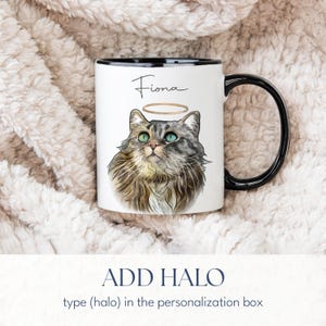 May include: White ceramic mug with a black handle and rim, featuring a watercolor illustration of a cat with a halo and the name "Fiona" in script. The text "ADD HALO" is below the mug.